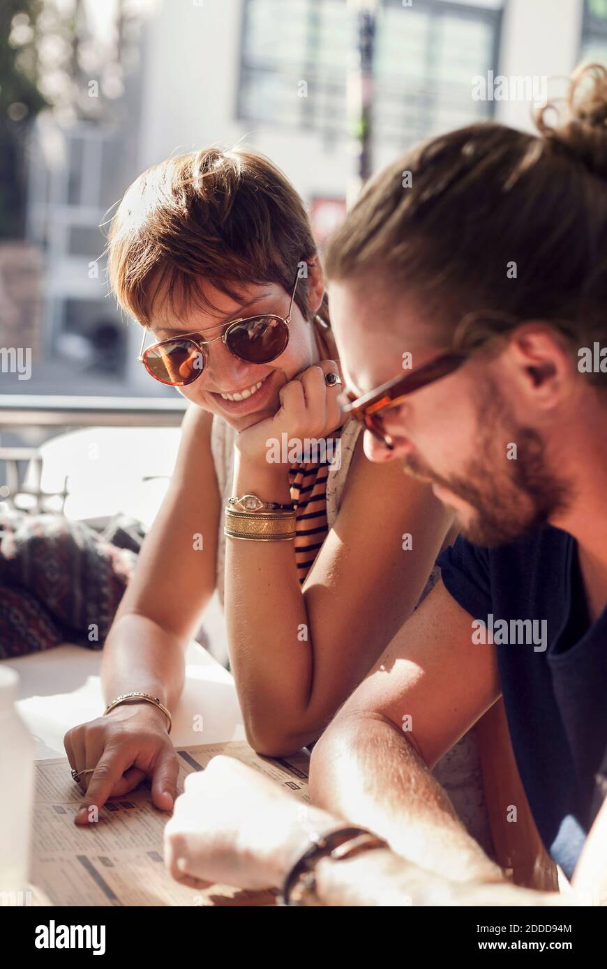 Woman sitting looking up at man hi-res stock photography and images - Alamy