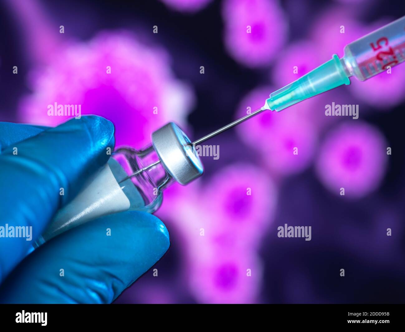 Hand in surgical glove holding vaccine for global pandemic Stock Photo