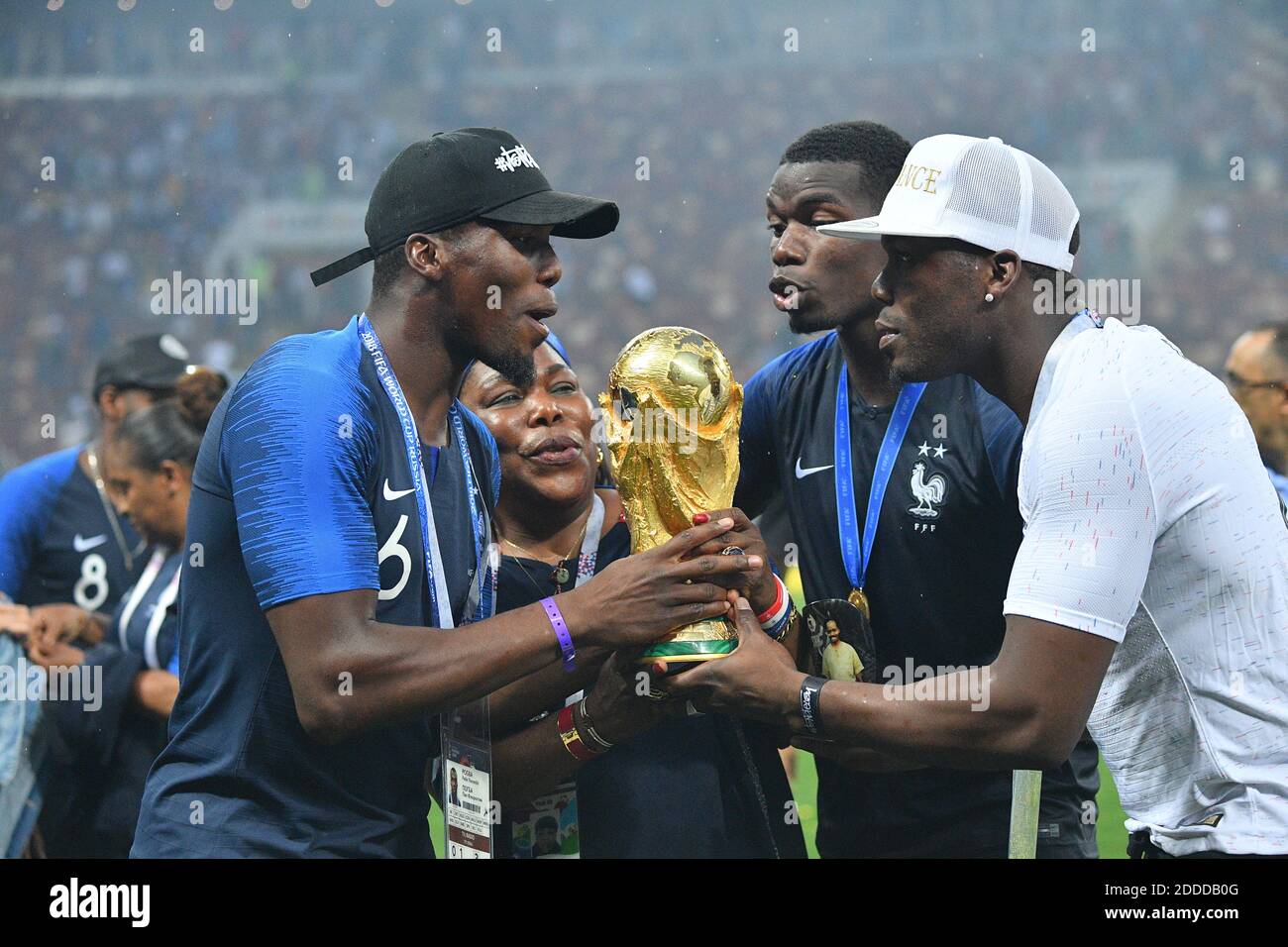 France's Paul Pogba, his mother Yeo and his brothers celebrate