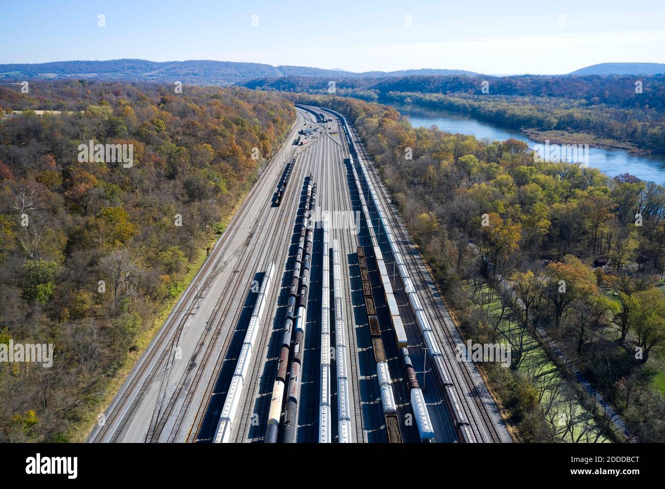 Aerial view of railroad cars waiting on tracks stretching along Chesapeake and Ohio Canal Stock Photo