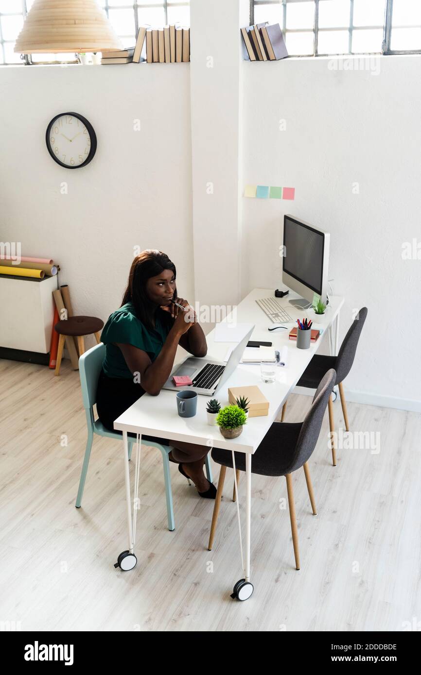 African american woman sitting desk hi-res stock photography and images ...