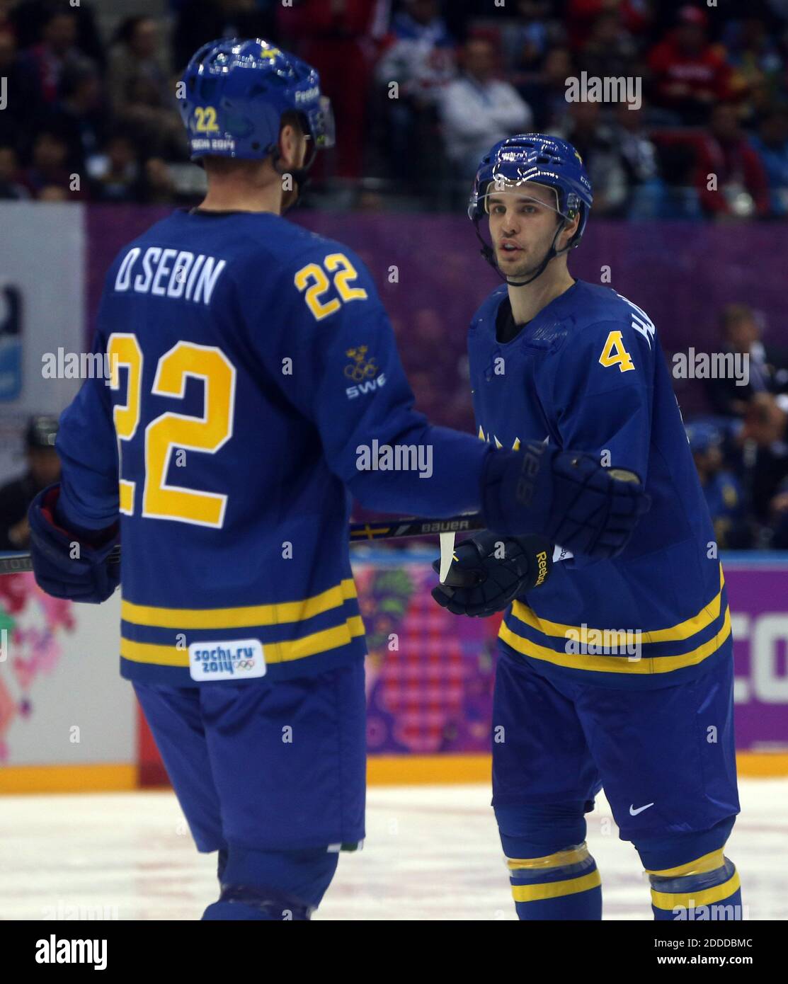 NO FILM, NO VIDEO, NO TV, NO DOCUMENTARY - Sweden's Daniel Sedin (22) and Niklas Hjalmarsson (4) talk in the second period of a men's hockey game at the Winter Olympics in Sochi, Russia, Wednesday, Feb. 12, 2014. Photo by Brian Cassella/Chicago Tribune/MCT/ABACAPRESS.COM Stock Photo