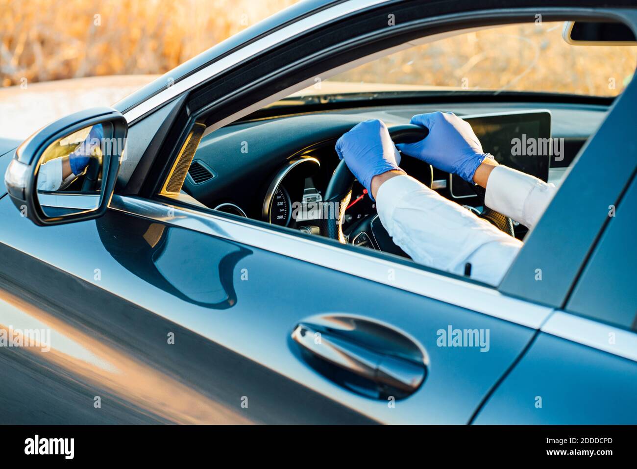 Hands of man on car steering wheel Stock Photo