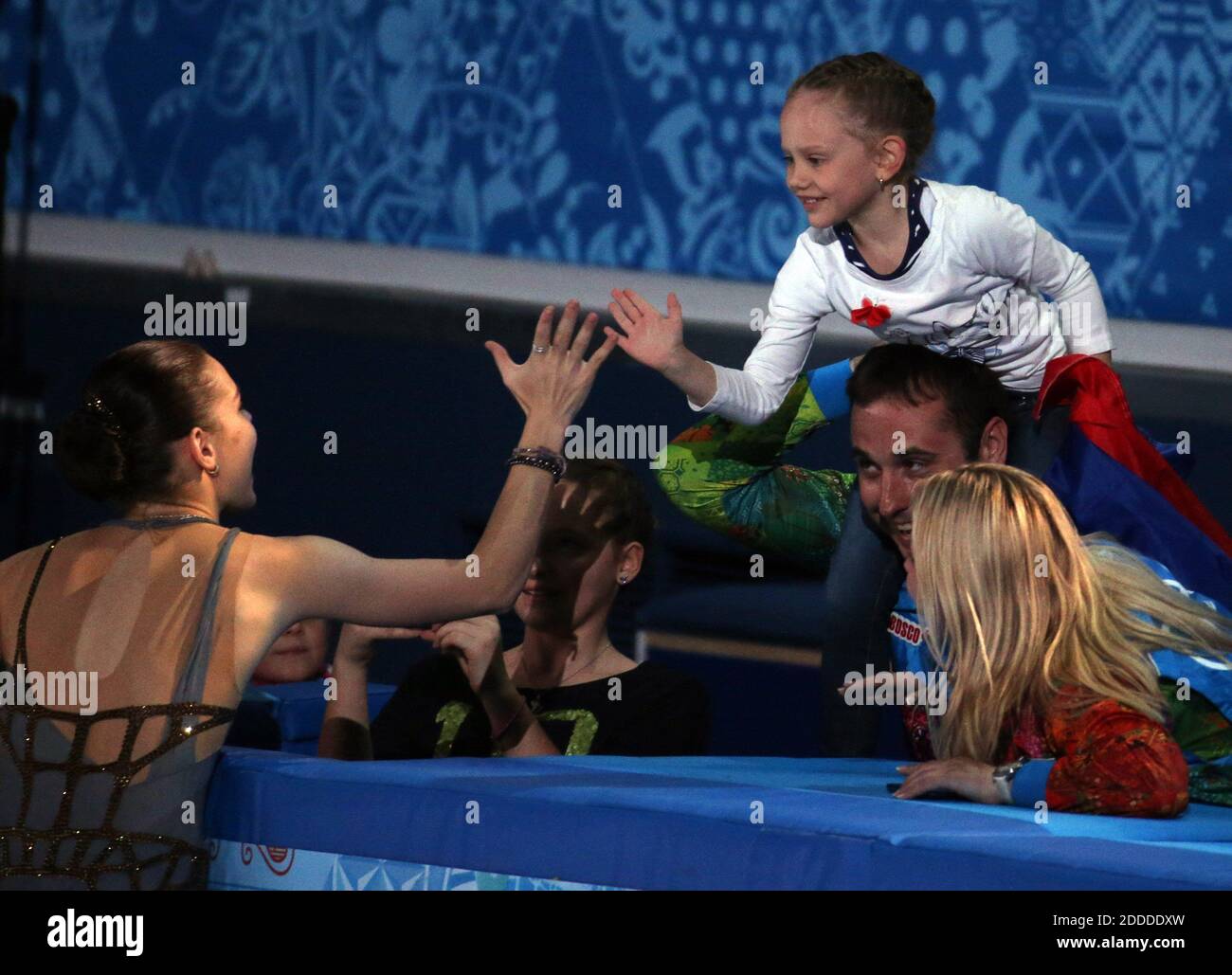 NO FILM, NO VIDEO, NO TV, NO DOCUMENTARY - Gold medalist Adelina Sotnikova of Russia celebrates with a young girl after ladies' figure skating at the Iceberg Skating Palace during the Winter Olympics in Sochi, Russia, Thursday, February 20, 2014. Photo by Brian Cassella/Chicago Tribune/MCT/ABACAPRESS.COM Stock Photo