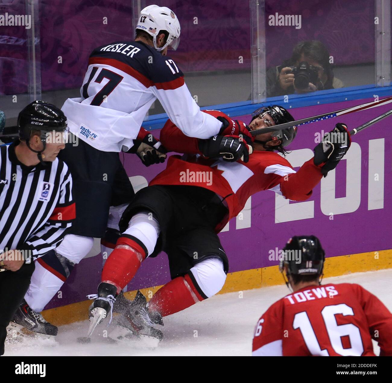 USA defenseman Anne Schleper (15) cross checks Canada forward Jayna Hefford  (16) in the second period of the women's hockey gold medal game at the  Bolshoy Ice Dome during the Winter Olympics