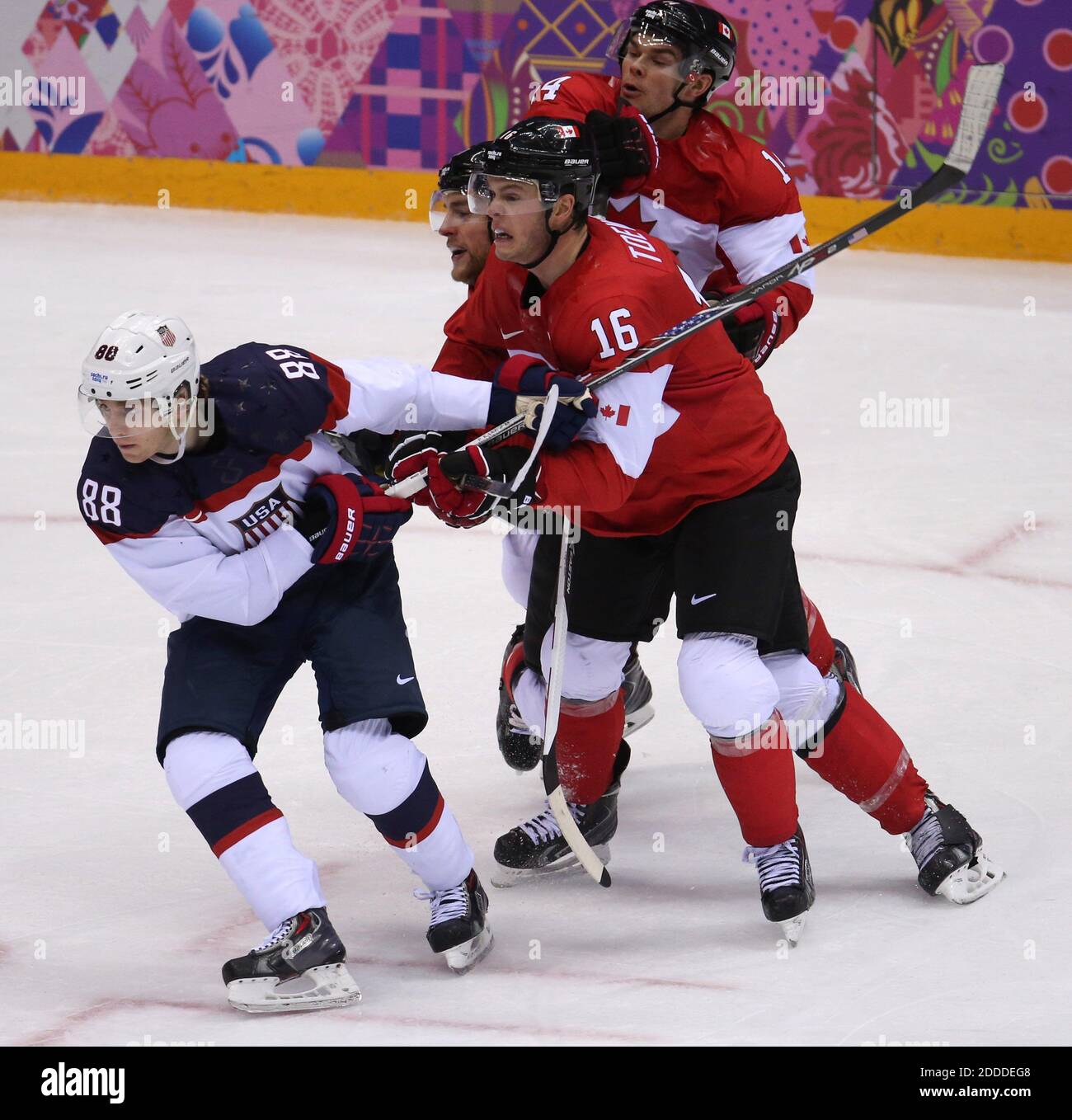 USA defenseman Anne Schleper (15) cross checks Canada forward Jayna Hefford  (16) in the second period of the women's hockey gold medal game at the  Bolshoy Ice Dome during the Winter Olympics