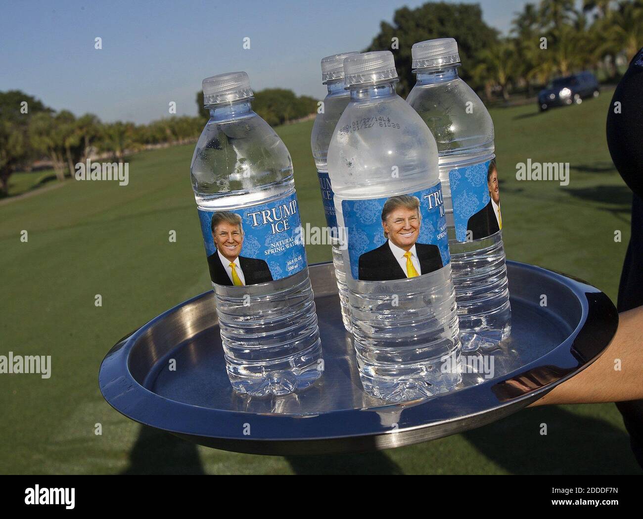 NO FILM, NO VIDEO, NO TV, NO DOCUMENTARY - A waitress passes out Trump water bottles at Trump National Doral, in Doral, FL, USA on February 6, 2014. Photo by David Walters/Miami Herald/MCT/ABACAPRESS.COM Stock Photo