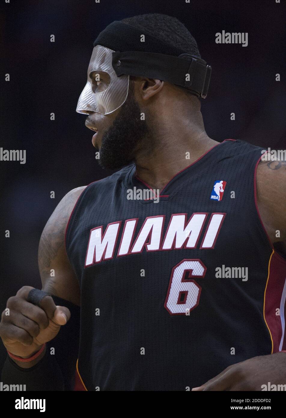 NO FILM, NO VIDEO, NO TV, NO DOCUMENTARY - LeBron James (6) of the Miami  Heat wears a protective face mask as his team faces the Houston Rockets in  the first half