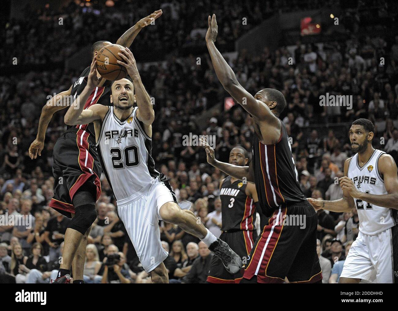NO FILM, NO VIDEO, NO TV, NO DOCUMENTARY - San Antonio Spurs guard Manu Ginobili drives past Miami Heat's Rashard Lewis and Chris Bosh during the first half in Game 5 of the NBA Finals at the AT&T Center in San Antonio, TX, USA, on Sunday, June 15, 2014. Photo by Michael Laughlin/Sun Sentinel/MCT/ABACAPRESS.COM Stock Photo