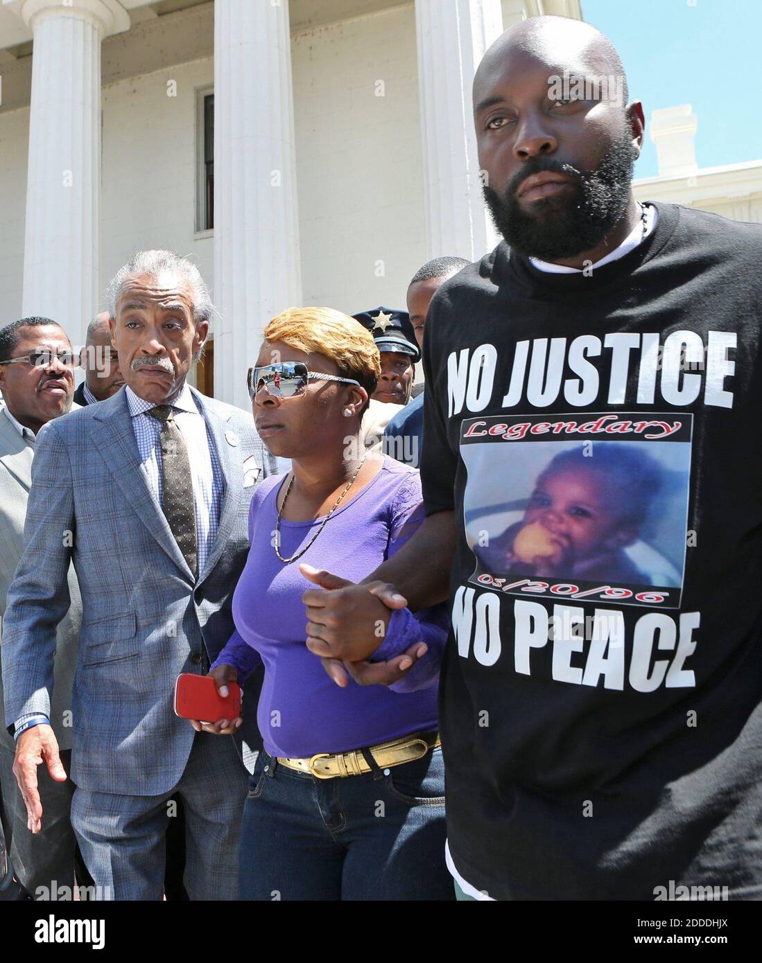 NO FILM, NO VIDEO, NO TV, NO DOCUMENTARY - Rev. Al Sharpton, left, and Michael Brown's parents Lesley McSpadden and Michael Brown Sr. leave a press conference that was held on the steps of the Old Courthouse in St. Louis, Mo., on Tuesday, August 12, 2014. Photo by J.B. Forbes/St. Louis Post-Dispatch/MCT/ABACAPRESS.COM Stock Photo