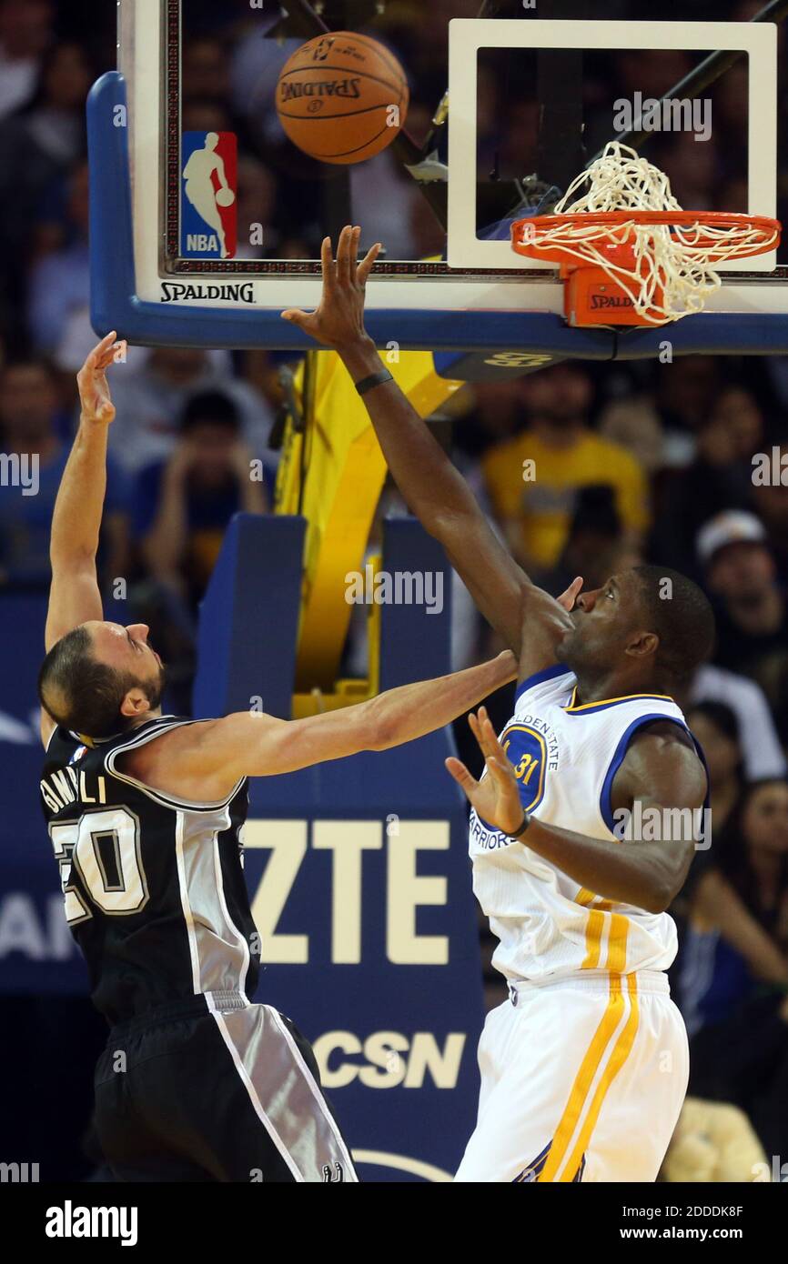 NO FILM, NO VIDEO, NO TV, NO DOCUMENTARY - The Golden State Warriors' Festus Ezeli, right, blocks a shot against the San Antonio Spurs' Manu Ginobili (20) in the first half at Oracle Arena in Oakland, CA, USA on November 11, 2014. The Spurs won, 113-100. Photo by Ray Chavez/Bay Area News Group/MCT/ABACAPRESS.COM Stock Photo