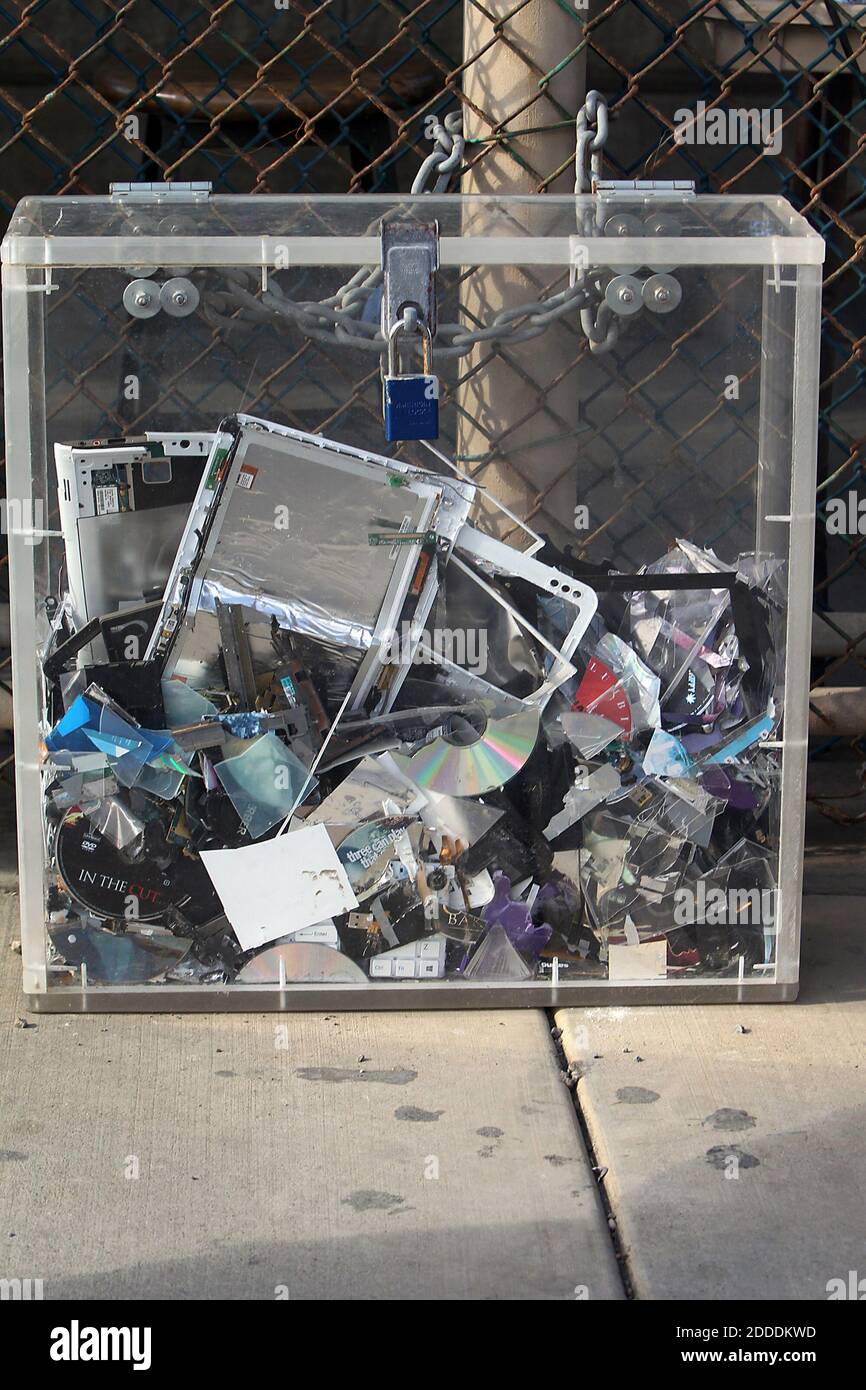 NO FILM, NO VIDEO, NO TV, NO DOCUMENTARY - A display of shreded cell phones, discs, tablets, and other contraband electronic equipment serves as a cautionary tale at the entrance to to the Camp 5-6 prison compound on Tuesday, Nov. 4, 2014 at the U.S. Navy base at Guantanamo Bay, Cuba, in this photo approved for release by the U.S. military. The electronics belonging to prison staff somehow eluded gate guards, got inside and was destroyed. If someone is found with prohibited electronics such as a personal cellphone before he or she goes in, according to the military, the gate guards store it. B Stock Photo