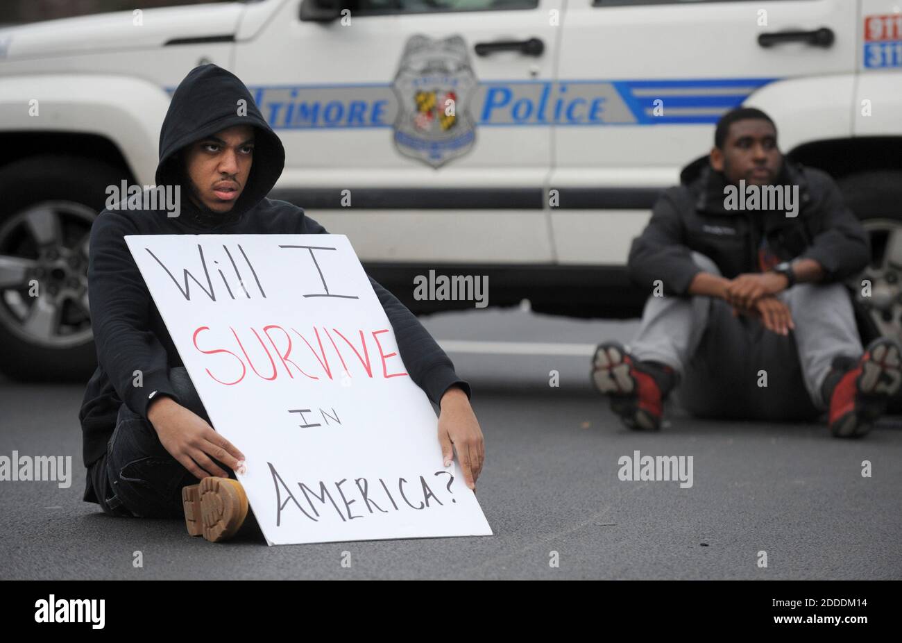 NO FILM, NO VIDEO, NO TV, NO DOCUMENTARY - Jimmy Sellers, a Morgan State senior, sits in the intersection of Perring Parkway and Cold Spring Lane during a a rally in Baltimore, MD, USA, on Tuesday, Nov. 25, 2014, in the wake of the grand jury decision not to indict officer Darren Wilson in the shooting death of Ferguson, Mo., teen Michael Brown. Photo by Jerry Jackson/Baltimore Sun/TNS/ABACAPRESS.COM Stock Photo