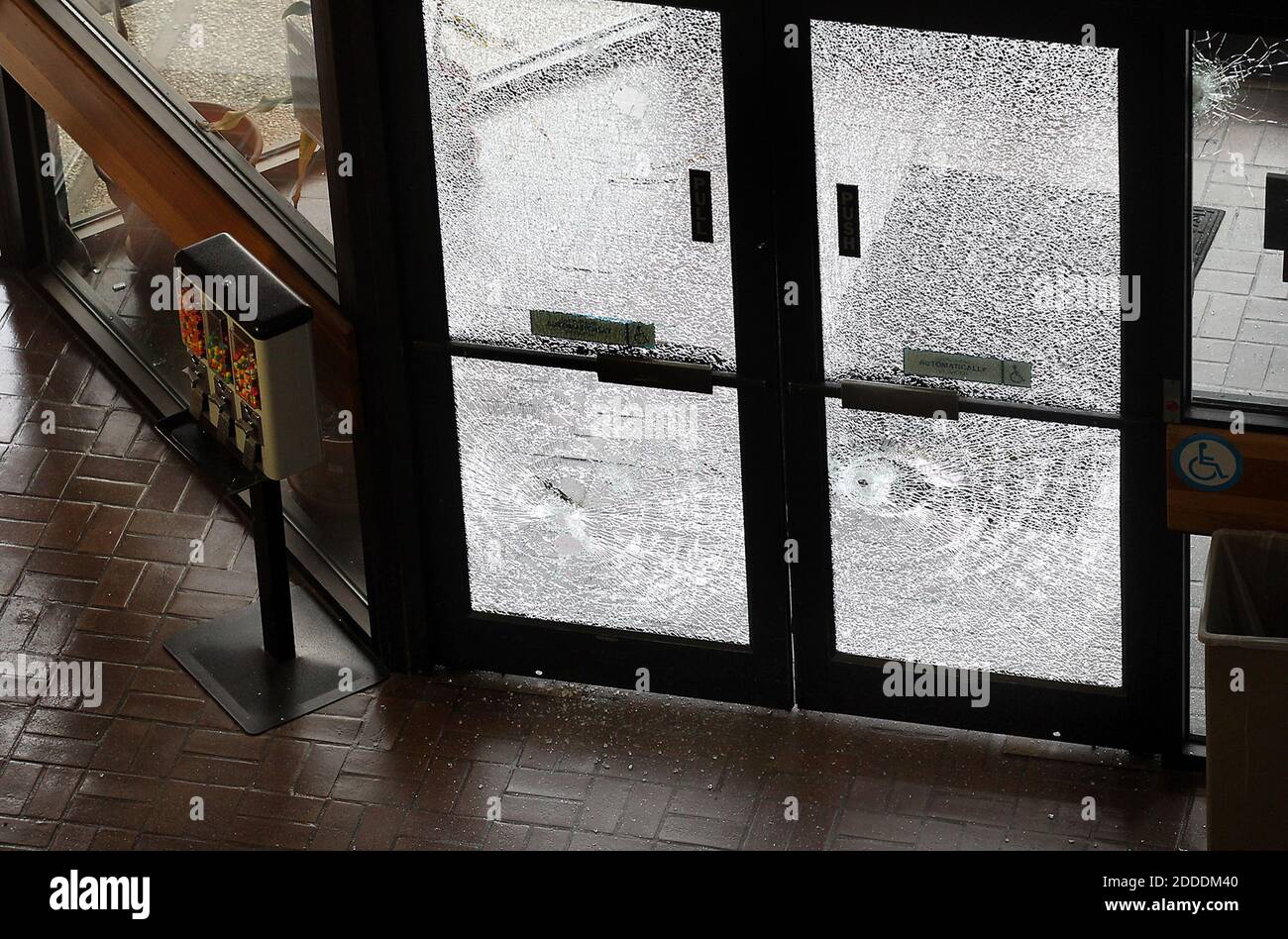 NO FILM, NO VIDEO, NO TV, NO DOCUMENTARY - Bullets shattered glass windows and doors, spraying glass inside police headquarters on Friday, November 28, 2014 after a gunman, identified by law enforcement sources as Larry Steve McQuilliams, targeted buildings in downtown Austin, TX, USA, including the Mexican consulate, the federal courthouse and Austin police headquarters before being shot and killed by police Friday morning in Austin, Texas. Photo by Laura Skelding/Austin American-Statesman/TNS/ABACAPRESS.COM Stock Photo
