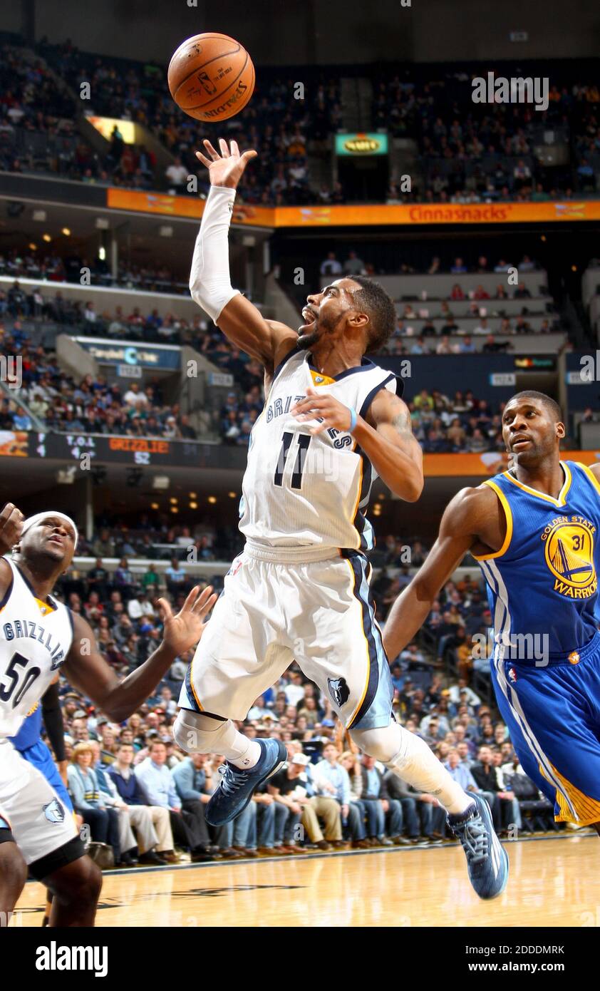 NO FILM, NO VIDEO, NO TV, NO DOCUMENTARY - The Memphis Grizzlies' Mike Conley (11) shoots as teammate Zach Randolph, left, and the Golden State Warriors' Festus Ezeli, right, look on at FedExForum in Memphis, TN, USA on December 16, 2014. The Grizzlies won, 105-98. Photo by Nikki Boertman/The Commercial Appeal/ABACAPRESS.COM Stock Photo