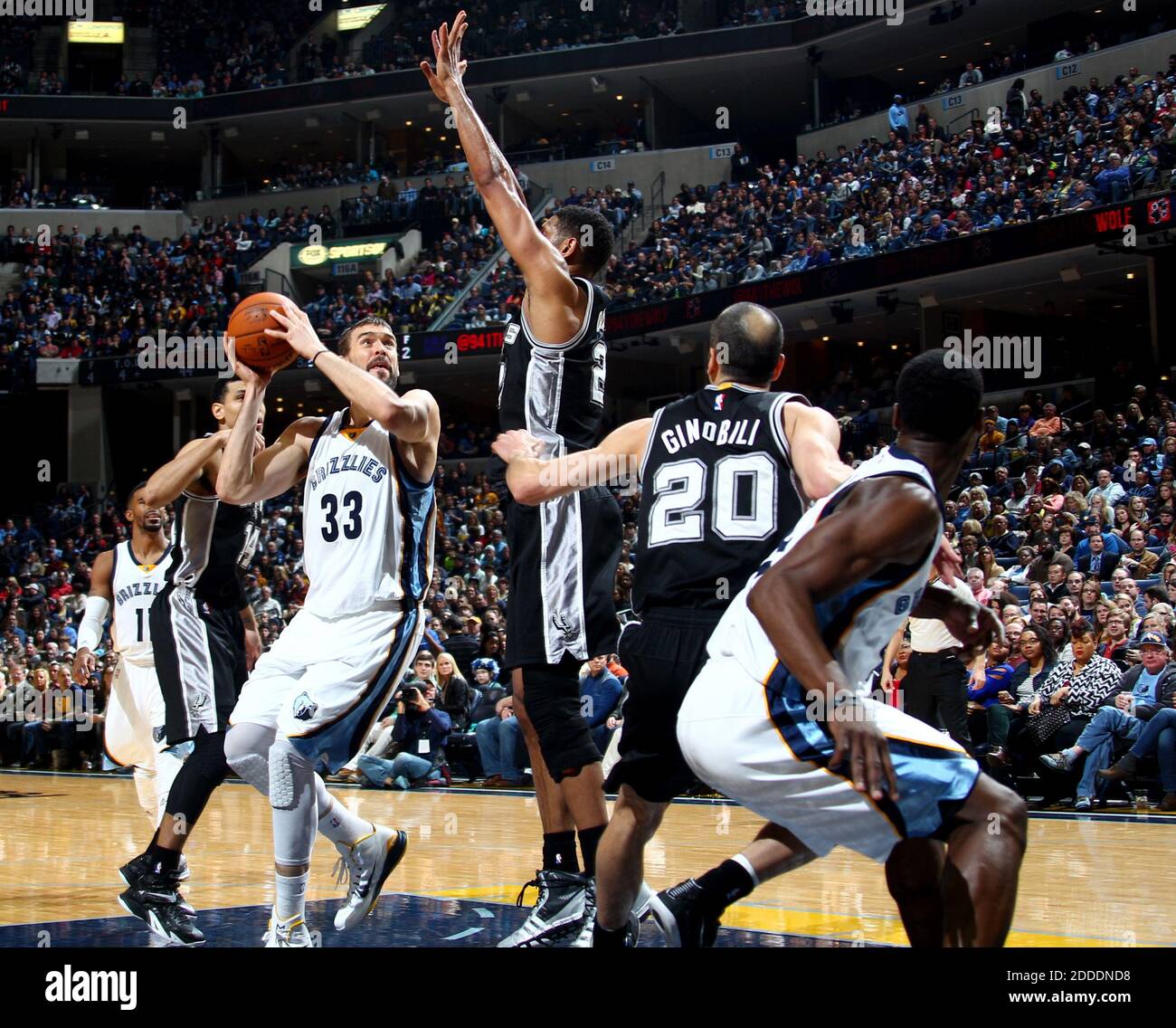 NO FILM, NO VIDEO, NO TV, NO DOCUMENTARY - Memphis Grizzlies' Marc Gasol shoots, defended by San Antonio Spurs' Danny Green, left, Tim Duncan and Manu Ginobili (20) on Tuesday, December 30, 2014 at FedExForum in Memphis, TN, USA. The Grizzlies won 95-87. Photo by Nikki Boertman/The Commercial Appeal/TNS/ABACAPRESS.COM Stock Photo