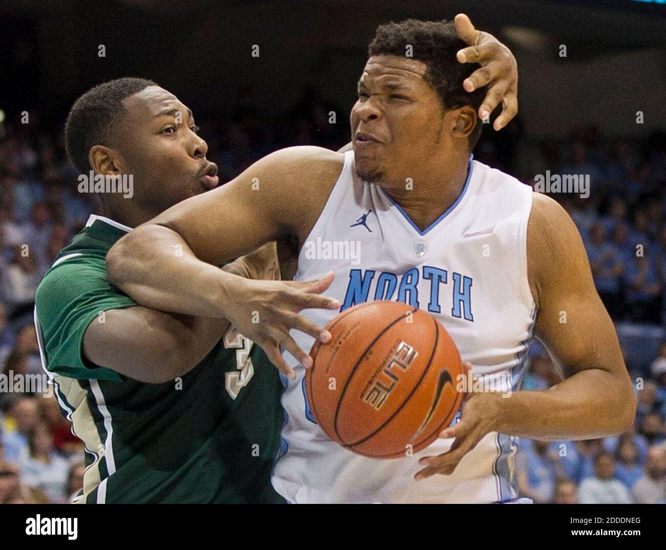 NO FILM, NO VIDEO, NO TV, NO DOCUMENTARY - UAB's Chris Cokely (3) give North Carolina's Kennedy Meeks a tap on the head during the second half at the Smith Center in Chapel Hill, NC, USA, on Saturday, December 27, 2014. The host Tar Heels won, 89-58. Photo by Robert Willett/Raleigh News & Observer/TNS/ABACAPRESS.COM Stock Photo