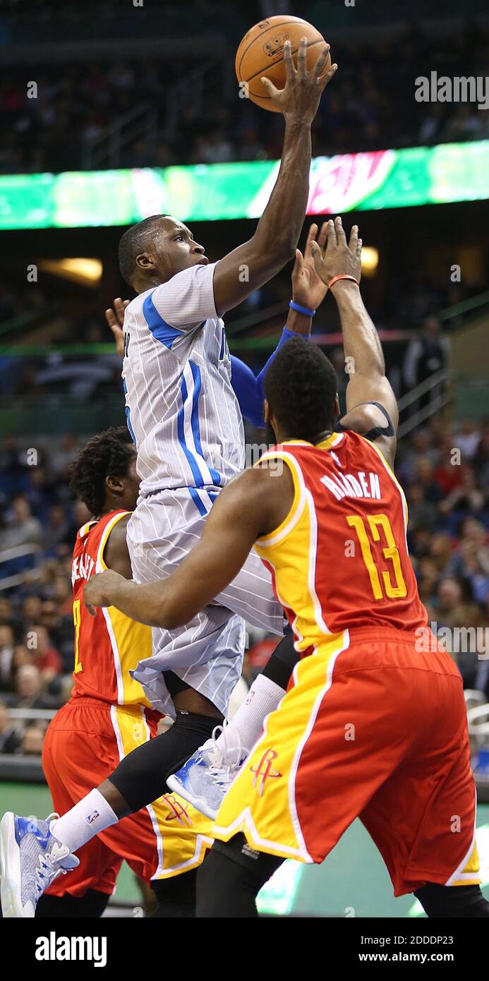 NO FILM, NO VIDEO, NO TV, NO DOCUMENTARY - The Orlando Magic's Victor Oladipo scores over the Houston Rockets' James Harden (13) at the Amway Center in Orlando, FL, USA on January 14, 2015. Photo by Stephen M. Dowell/Orlando Sentinel/TNS/ABACAPRESS.COM Stock Photo