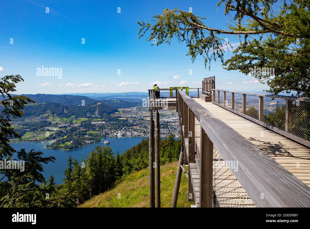 Austria, Upper Austria, Gmunden, Observation platform on summit of Grunberg mountain with lakeshore town in background Stock Photo