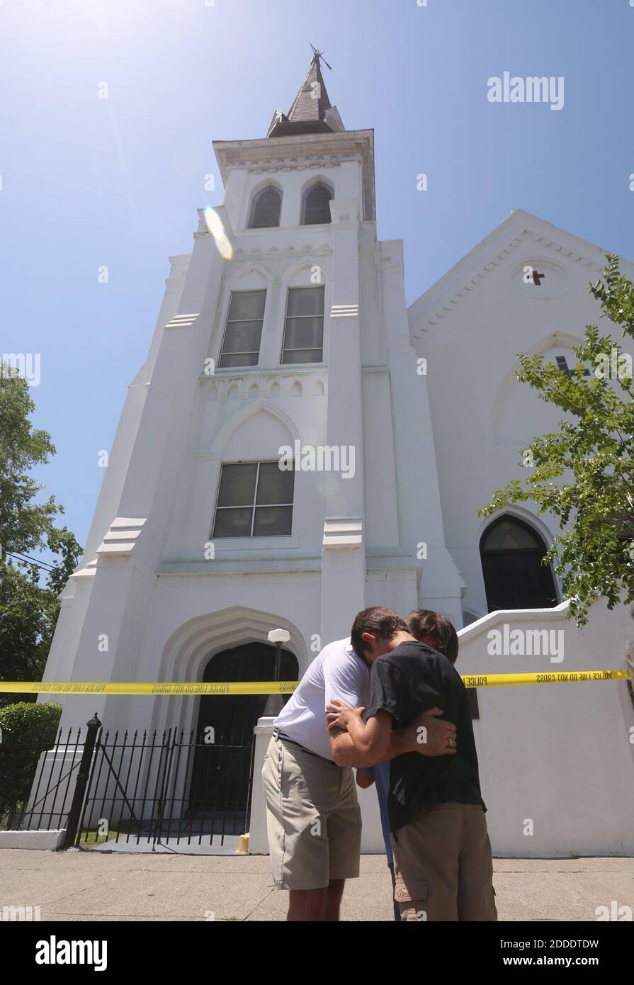 NO FILM, NO VIDEO, NO TV, NO DOCUMENTARY - Aaron Eller and his boys, Leim and Graham, pray in front of Emanuel AME Church on June 18, 2015 in Charleston, SC, USA., where a gunman killed nine people inside. Photo by Tim Dominick/The State/TNS/ABACAPRESS.COM Stock Photo