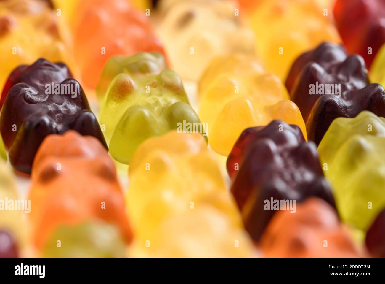 Colorful fruity gummy bears background, close up shot Stock Photo