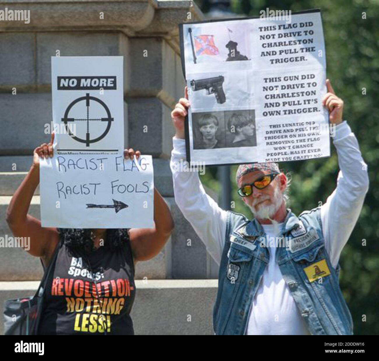 No Film No Video No Tv No Documentary John Miller Left Holds A Sign During A Rally To Show Support For The Removal Of The Confederate Battle Flag From The South
