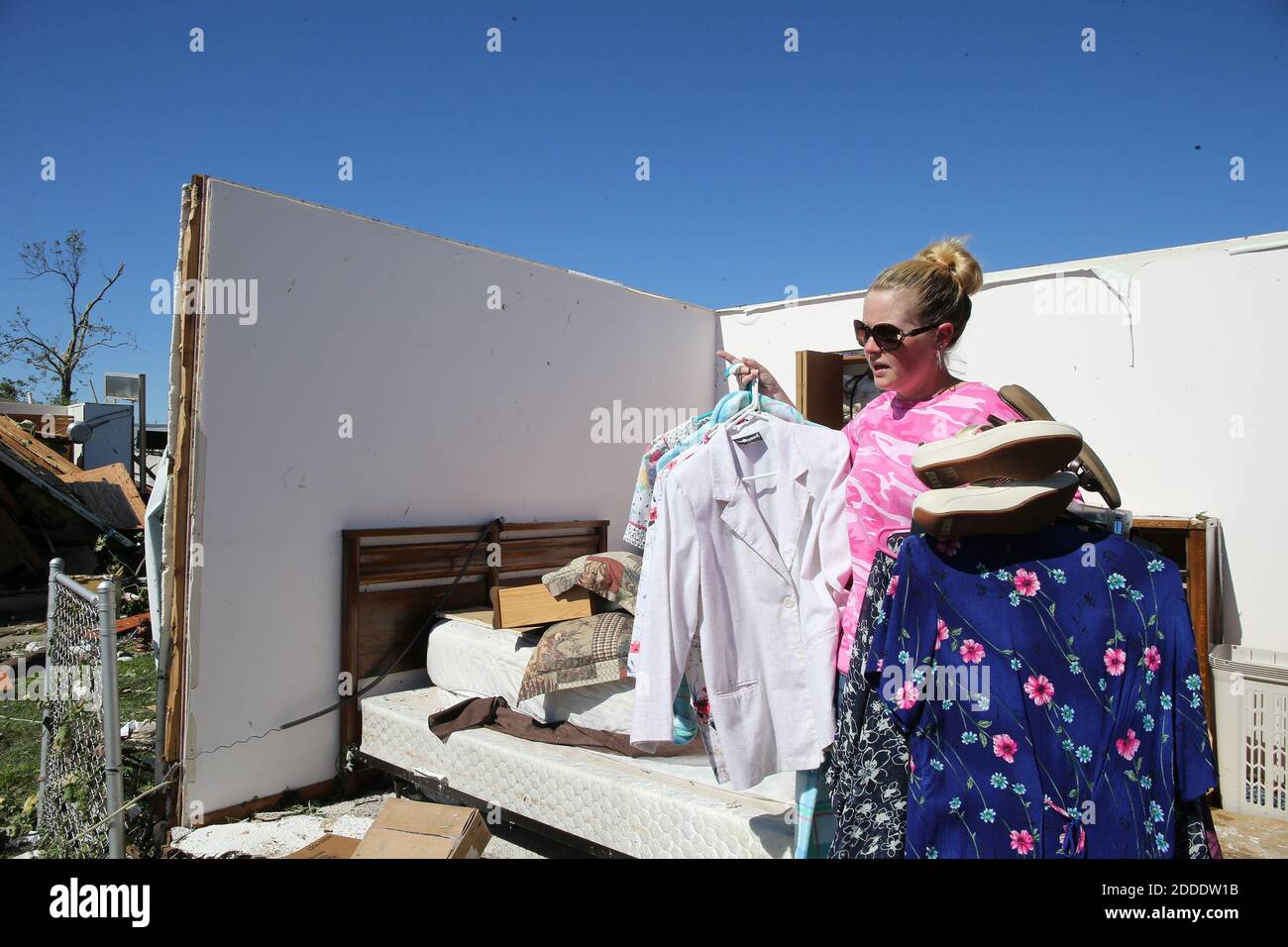 NO FILM, NO VIDEO, NO TV, NO DOCUMENTARY - Janelle Ramsey helps her parents deal with their destroyed home on Mazon Street in Coal City, IL, USA, on Tuesday, June 23, 2015, the morning after a severe storm tore through the area. Photo by Antonio Perez/Chicago Tribune/TNS/ABACAPRESS.COM Stock Photo