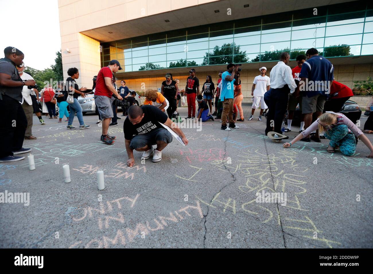 NO FILM, NO VIDEO, NO TV, NO DOCUMENTARY - Demonstrators use chalk to write messages in the parking lot of the Arlington Police Station on Monday, Aug. 10, 2015. The demonstrators gathered to protest the fatal shooting of burglary suspect Christian Taylor by rookie Arlington police officer Brad Miller early Friday morning. Photo by Brandon Wade/Fort Worth Star-Telegram/TNS/ABACAPRESS.COM Stock Photo