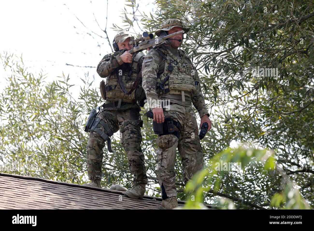 NO FILM, NO VIDEO, NO TV, NO DOCUMENTARY - A sniper and a lookout stand on top of a roof searching for two men following the killing of a police officer Tuesday, Sept. 1, 2015 in Fox Lake, IL, USA. Photo by Stacey Wescott/Chicago Tribune/TNS/ABACAPRESS.COM Stock Photo