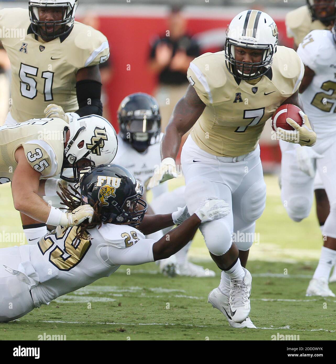 NO FILM, NO VIDEO, NO TV, NO DOCUMENTARY - UCF running back Dontravious Wilson (7) runs away from Floirda International defenders at Bright House Networks Stadium in Orlando, Fla., on Thursday, Sept. 3, 2015. FIU won, 15-14. (Stephen M. Dowell/Orlando Sentinel/TNS/ABACAPRESS.COM Stock Photo