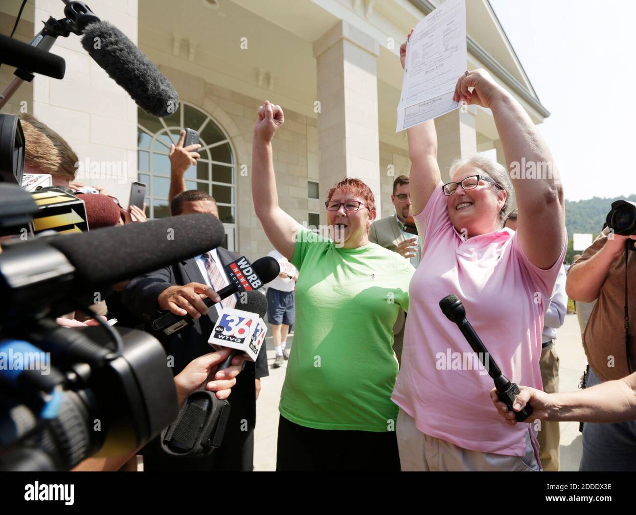 NO FILM, NO VIDEO, NO TV, NO DOCUMENTARY - Plaintiffs Karen Roberts, left, and April Miller celebrate after receiving their marriage license from Deputy Clerk Brian Mason at the Rowan County clerk's office in the County Courthouse in Morehead, KY, USA, on Friday, September 4, 2015. Photo by Pablo Alcala/Lexington Herald-Leader/TNS/ABACAPRESS.COM Stock Photo