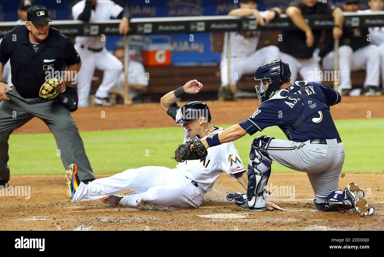 NO FILM, NO VIDEO, NO TV, NO DOCUMENTARY - The Miami Marlins' Derek Dietrich slides into home plate as Milwaukee Brewers catcher Nevin Ashley, right, tags him out in the fourth inning on Wednesday, Sept. 9, 2015, at Marlins Park in Miami. (Pedro Portal/El Nuevo Herald/TNS) Stock Photo