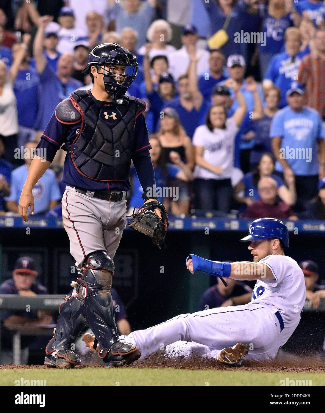 NO FILM, NO VIDEO, NO TV, NO DOCUMENTARY - The Kansas City Royals' Ben Zobrist scores behind Minnesota Twins catcher Kurt Suzuki on a sacrifice fly by Lorenzo Cain to tie the game in the eighth inning on Wednesday, Sept. 9, 2015, at Kauffman Stadium in Kansas City, Mo. (John Sleezer/Kansas City Star/TNS) Stock Photo