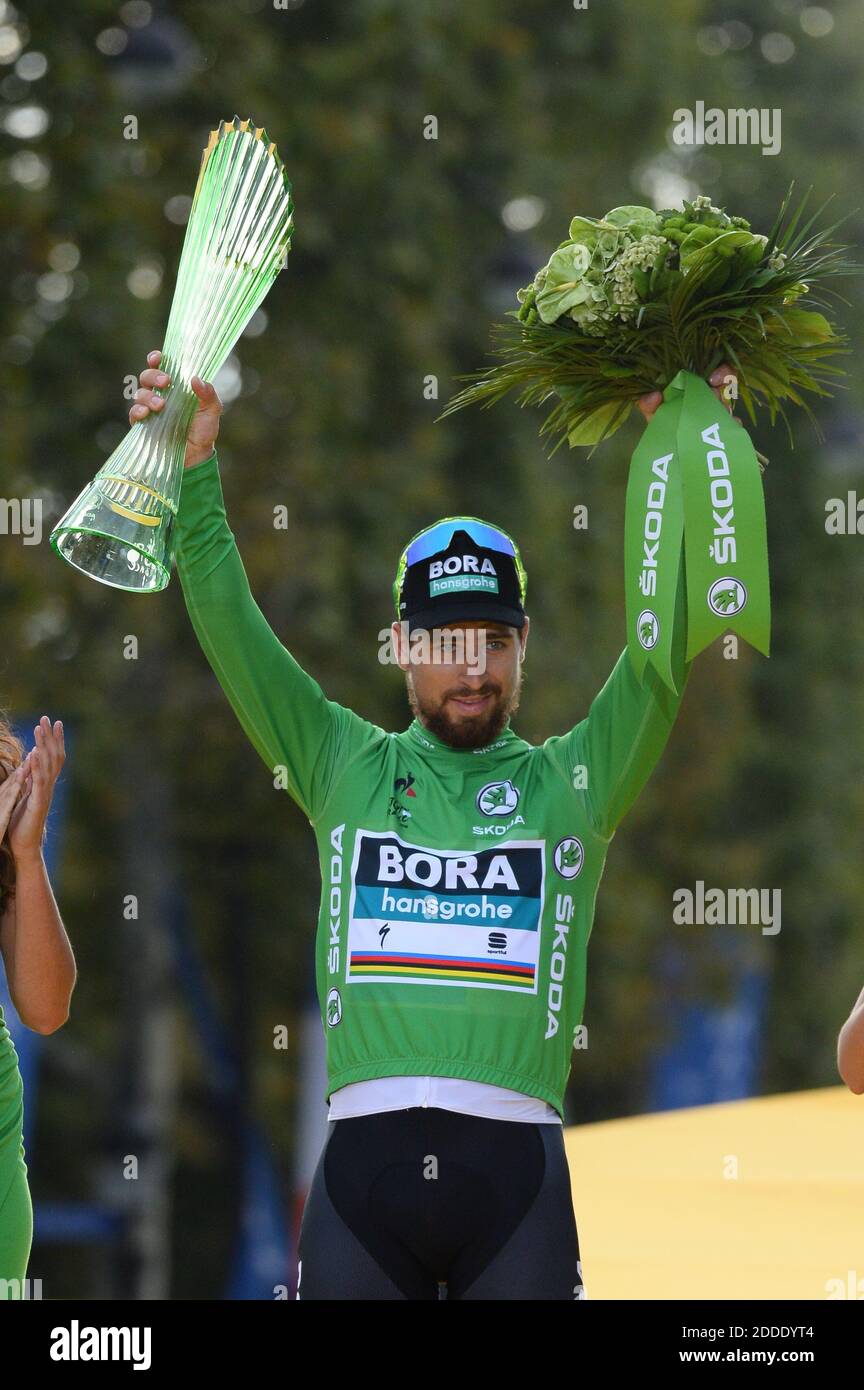 Slovakia's Peter Sagan celebrates his overall best sprinter's green jersey  on the podium after the 21st and last stage of the 105th edition of the  Tour de France cycling race between Houilles