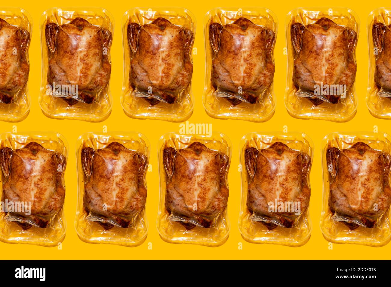 Vacuum packed roasted chickens on yellow background Stock Photo Alamy