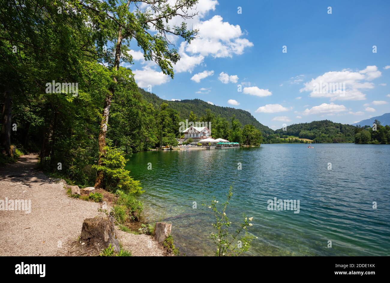Germany, Bavaria, Bad Reichenhall, Shore of Thumsee lake in summer with restaurant in background Stock Photo