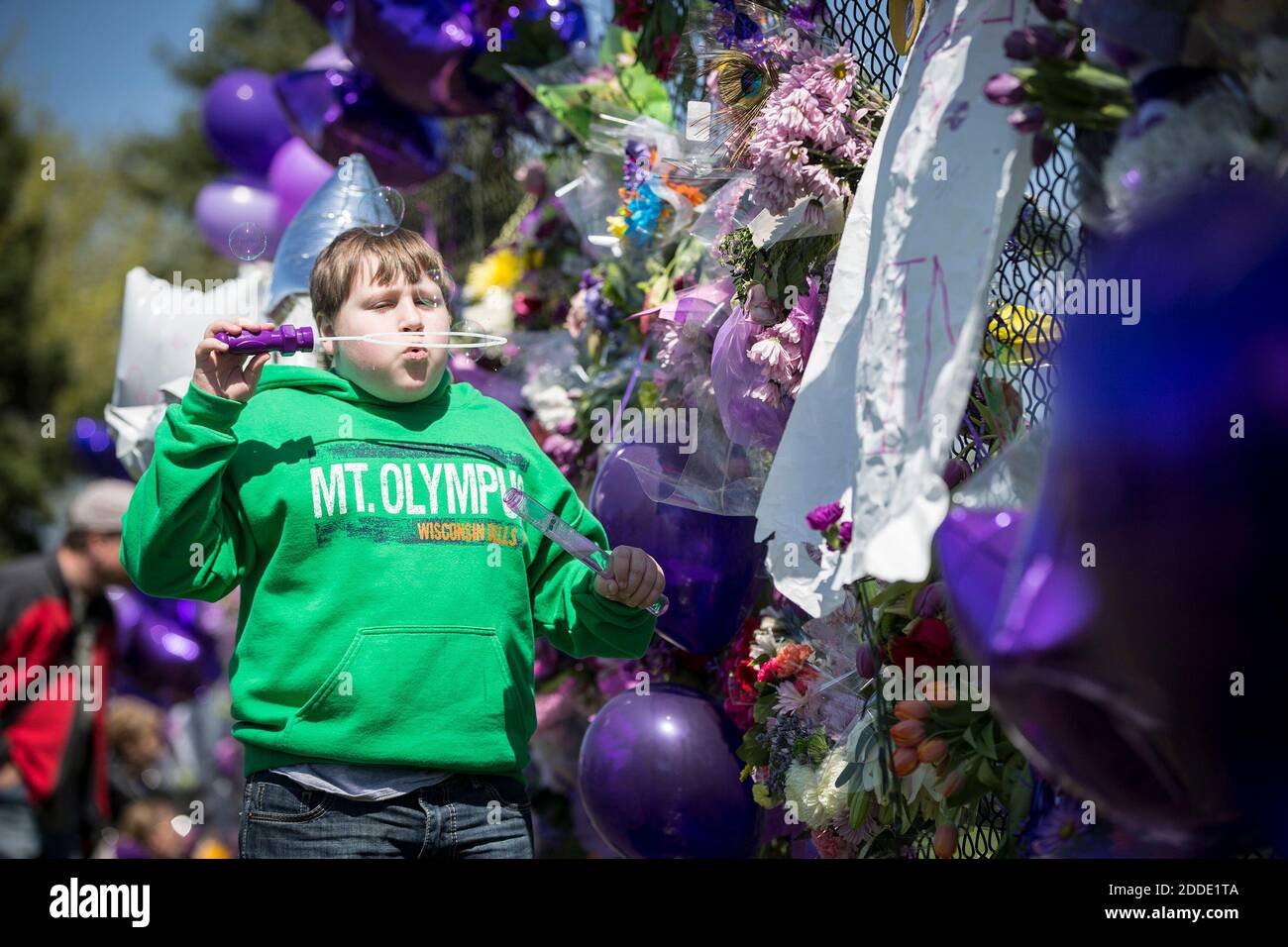 NO FILM, NO VIDEO, NO TV, NO DOCUMENTARY - Seth Berner, 10, of Buffalo,  N.Y., blows bubbles from a purple bubble set outside Prince's house at  Paisley Park on Friday, April 22,