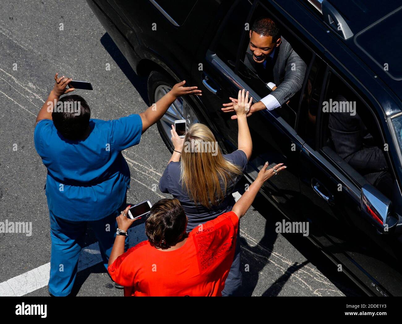 NO FILM, NO VIDEO, NO TV, NO DOCUMENTARY - Will Smith greets fans as the funeral procession for Muhammad Ali makes its way along Broadway to a funeral in Cave Hill Cemetery, in downtown Louisville, Ky., on Friday, June 10, 2016. Ali, a three-time world heavyweight champion, died June 3, 2016, at 74. Photo by Pablo Alcala/Lexington Herald-Leader/TNS/ABACAPRESS.COM Stock Photo