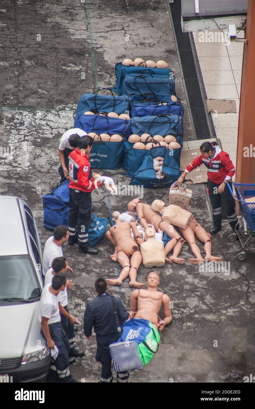Red Cross workers unload consignment of First Aid dummies Stock Photo