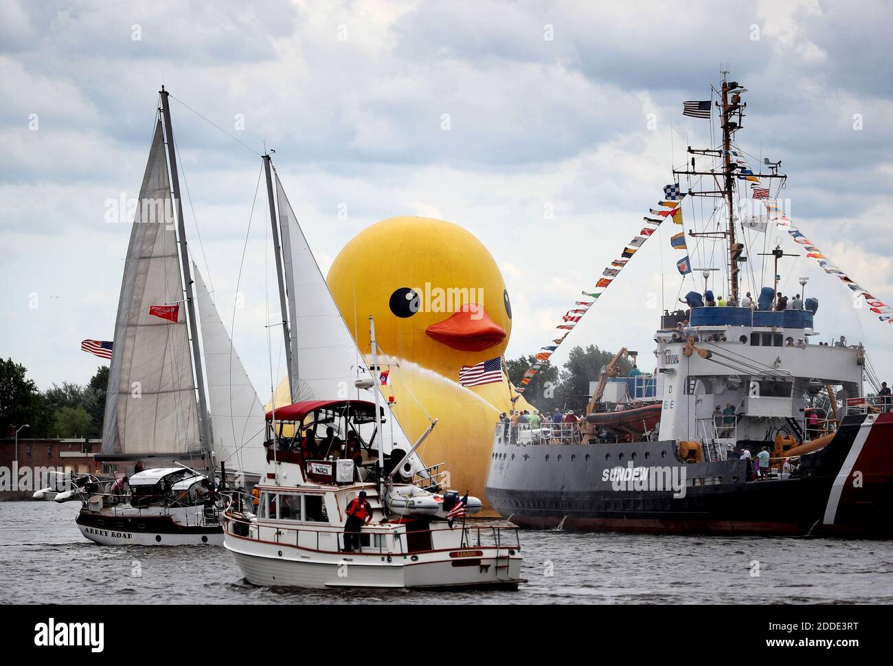 NO FILM, NO VIDEO, NO TV, NO DOCUMENTARY - Tall Ships Duluth 2016 was back in Duluth and featured the world's largest rubber duck at 61 feet tall, about the height of a six-story building, and weighing in at 11 tons, equaling roughly 3,000 real ducks, on Aug. 18, 2016 in Duluth, Minn. The rubber duck was seen being towed past the Sundew, a retired Coast Guard Cutter with water cannons firing. Photo by David Joles/Minneapolis Star Tribune/TNS/ABACAPRESS.COM Stock Photo