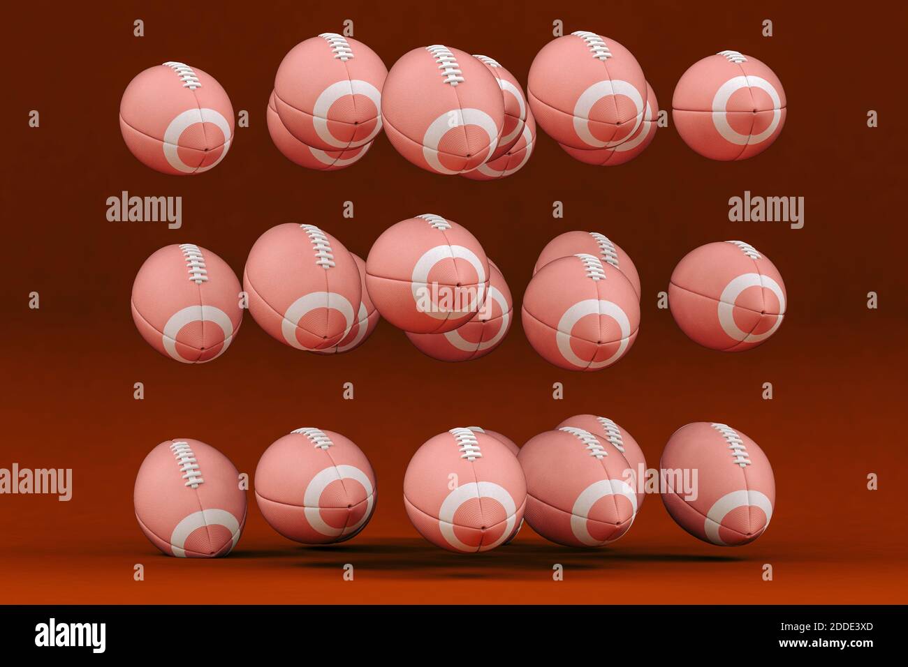 Rugby balls levitating against red background Stock Photo Alamy