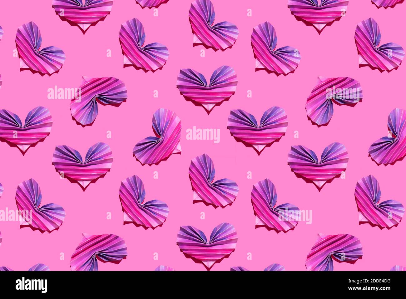 Pattern of pink and purple origami hearts Stock Photo