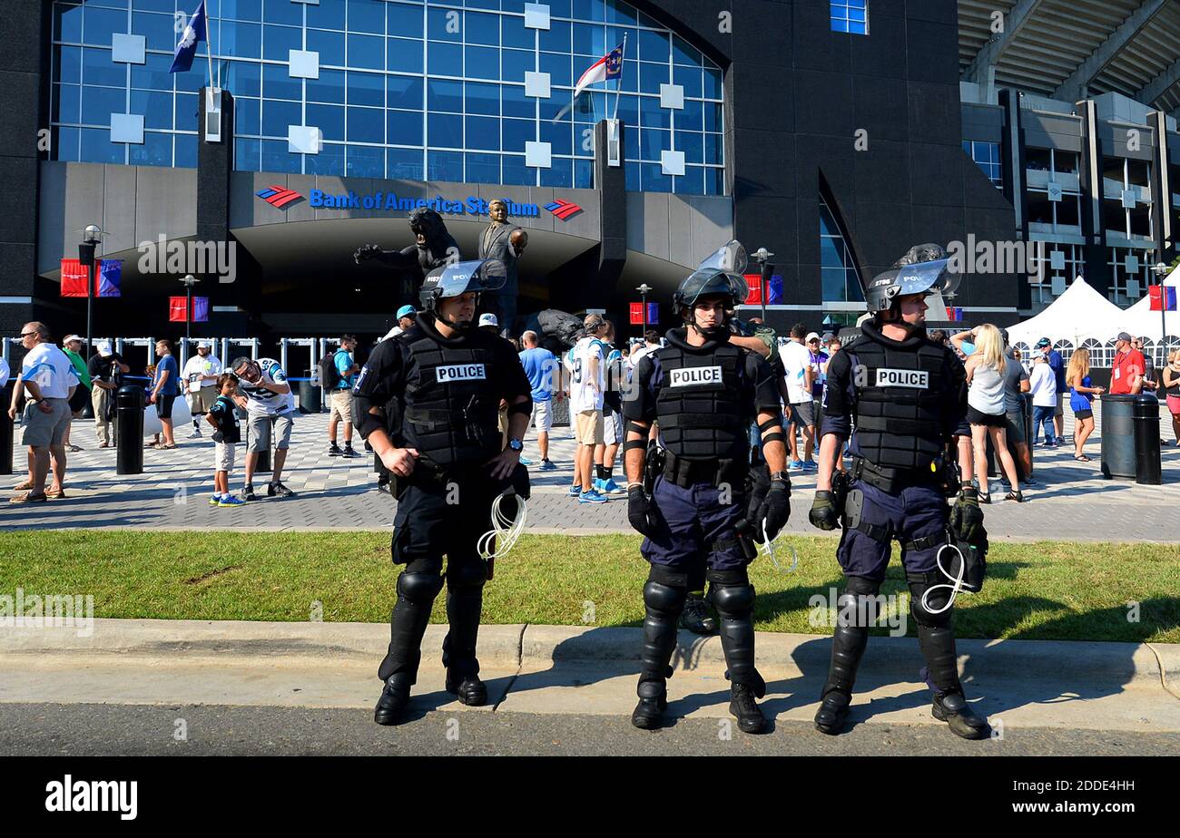 NO FILM, NO VIDEO, NO TV, NO DOCUMENTARY - Police in riot gear stand ...
