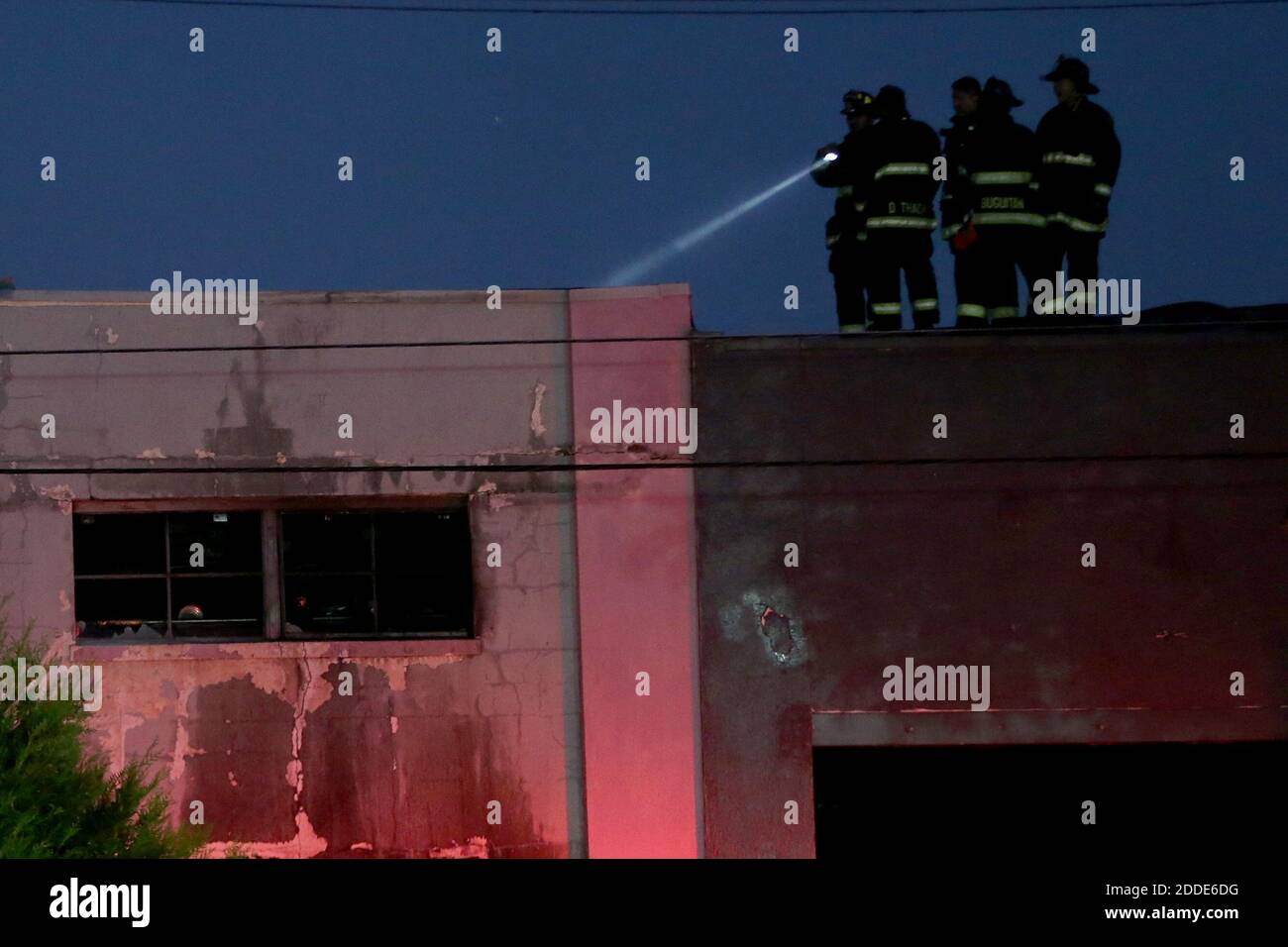 NO FILM, NO VIDEO, NO TV, NO DOCUMENTARY - Firefighters survey a fatal fire where at least nine people died in a warehouse party on 31st Avenue in Oakland, CA, USA, on Saturday, December 3, 2016. Photo by Ray Chavez/Bay Area News Group/TNS/ABACAPRESS.COM Stock Photo
