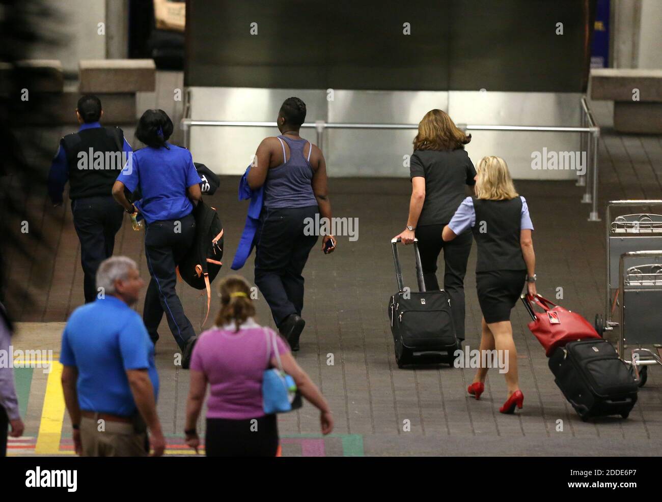 NO FILM, NO VIDEO, NO TV, NO DOCUMENTARY - Employees and pasengers walk into the parking garage at Fort Lauderdale-Hollywood International Airport on Friday, Jan. 6, 2017, in Fort Lauderdale, Fla. (David Santiago/El Nuevo Herald/TNS) Stock Photo