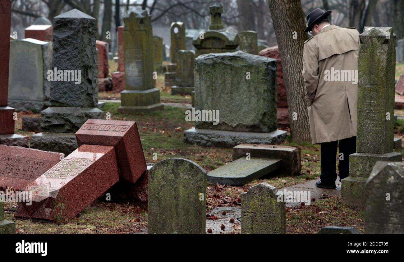 NO FILM, NO VIDEO, NO TV, NO DOCUMENTARY - People walk through toppled graves at Chesed Shel Emeth Cemetery in University City on Tuesday, February 21, 2017 where almost 200 gravestones were vandalized over the weekend. St. Louis, MO, USA. Photo by Robert Cohen/St. Louis Post-Dispatch/TNS/ABACAPRESS.COM Stock Photo