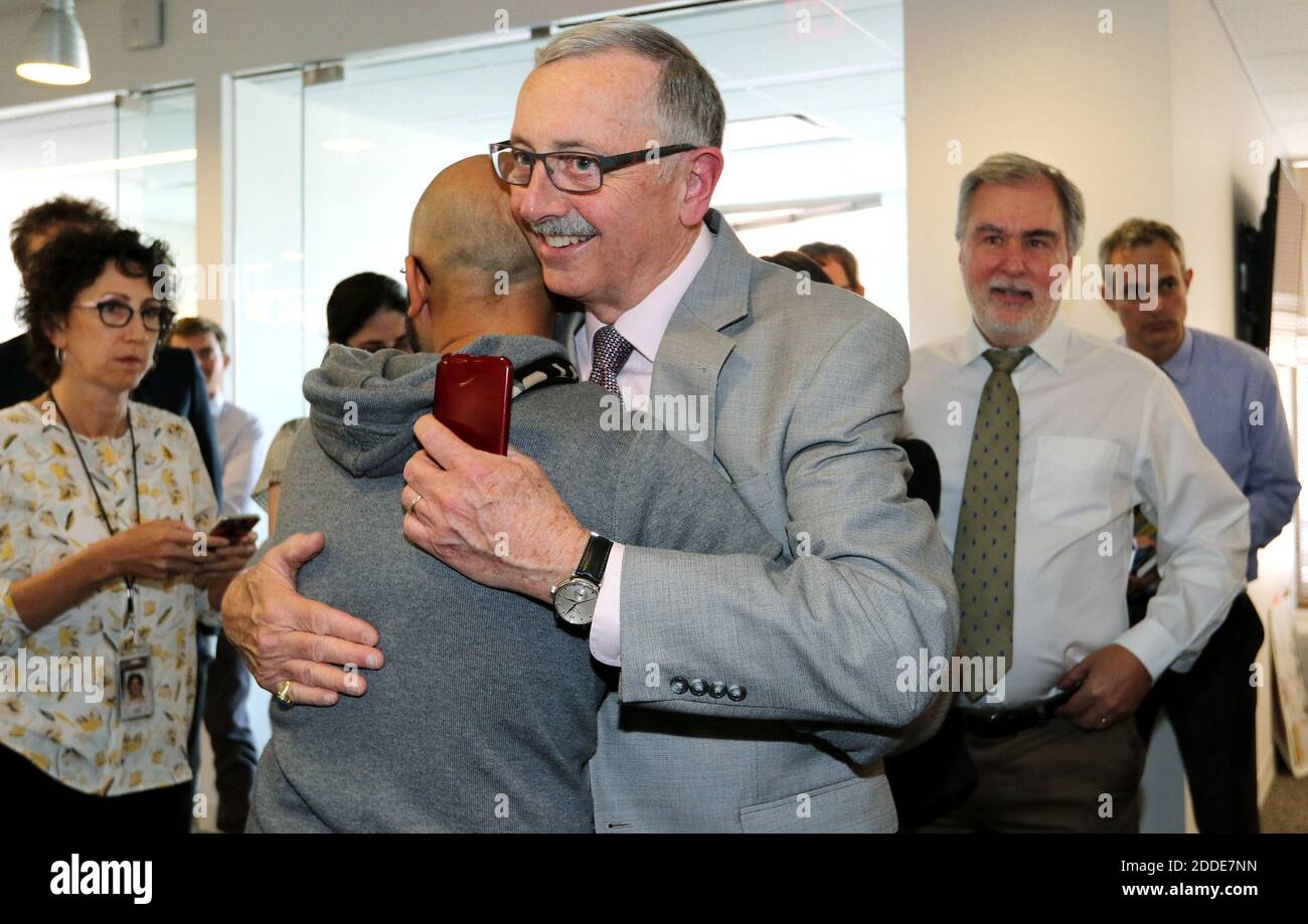 NO FILM, NO VIDEO, NO TV, NO DOCUMENTARY - Video Journalist Ali Rizvi hugs former McClatchy Bureau Chief James Asher after the 2017 Pulitzer Prize for Explanatory Journalism was awarded to the International Consortium of Investigative Journalists, McClatchy and the Miami Heraldfor the Panama Papers, a series of stories using a collaboration of more than 300 reporters on six continents to expose the hidden infrastructure and global scale of offshore tax havens. Photo by Cheryl Diaz Meyer/McClatchy Washington Bureau/TNS/ABACAPRESS.COM Stock Photo