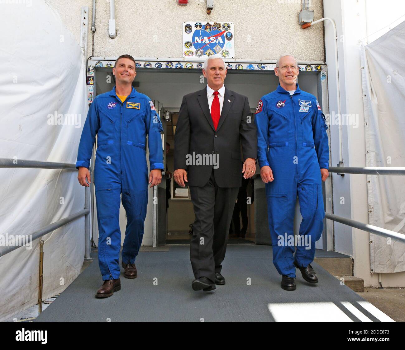 NO FILM, NO VIDEO, NO TV, NO DOCUMENTARY - Vice President Mike Pence, center, is flanked by NASA astronaut Reid Wiseman, left, and Patrick Forrester, NASA Chief astronaut, as they walk out of crew headquarters Thursday, July 6, 2017 at the Kennedy Space Center. Cape Canaveral, FL, USA, July 6, 2017. Photo by Red Huber/Orlando Sentinel/TNS/ABACAPRESS.COM Stock Photo