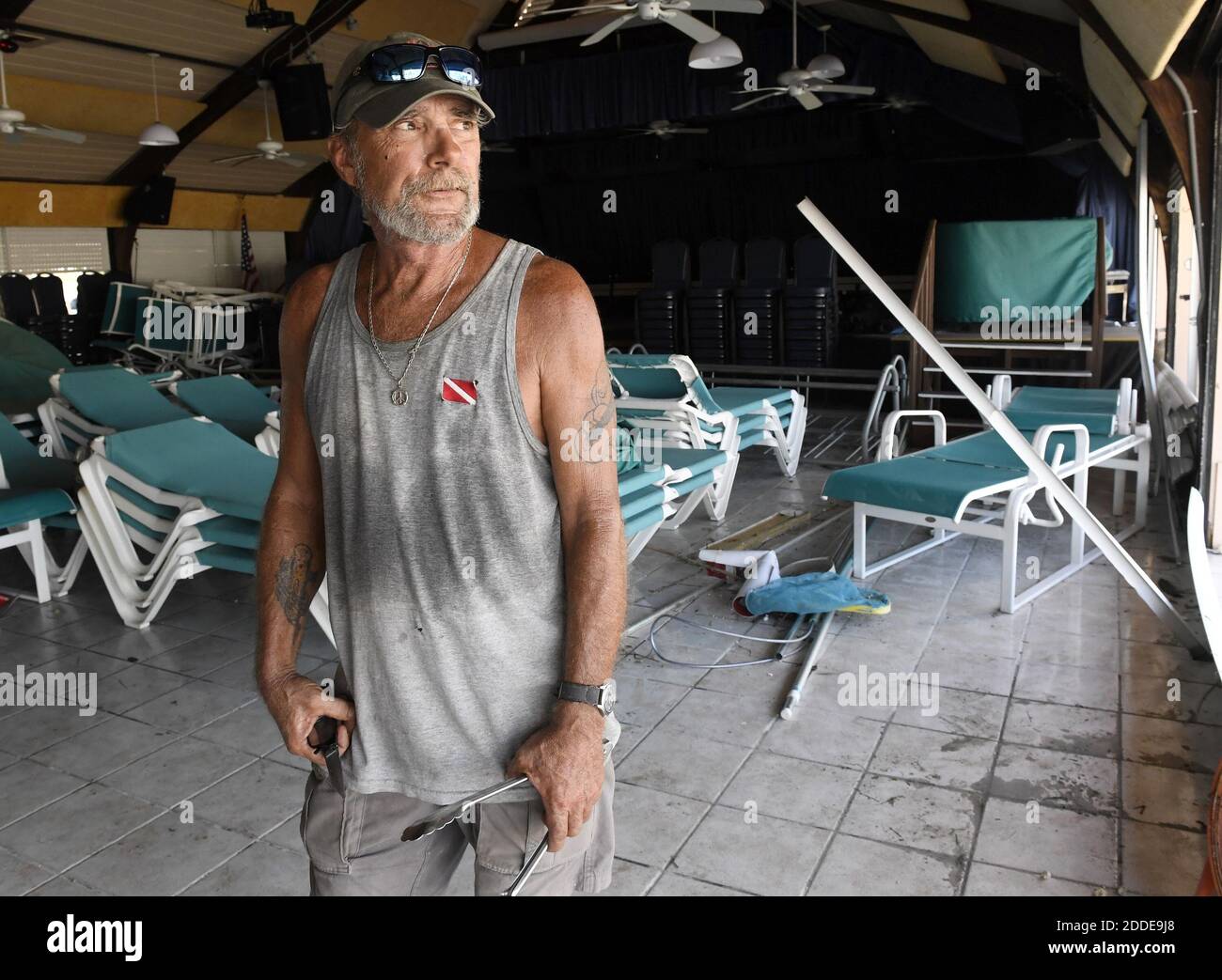 NO FILM, NO VIDEO, NO TV, NO DOCUMENTARY - Cudjoe Key resident Bob Skinner, 84, walks away with some cold water from Mark Lum, 57, who rode out powerful Hurricane Irma with his dog, Cruzan, and another friend in the Venture Out Condominium's bathhouse. 'We felt like the world was coming to an end,' said Lum on Tuesday, September 12, 2017. Photo by Taimy Alvarez/Sun Sentinel/TNS/ABACAPRESS.COM Stock Photo