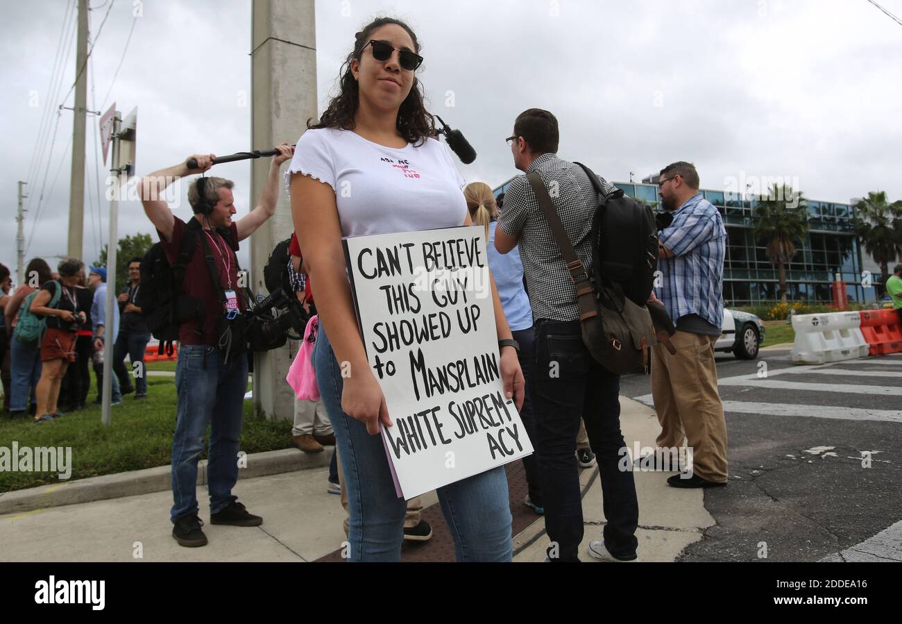 NO FILM, NO VIDEO, NO TV, NO DOCUMENTARY - Sahara Peters of Panama City, FL, USA, holds signs in protest of White nationalist Richard Spencer delivering a speech at the University of Florida in Gainesville, FL, USA, on Thursday, October 19, 2017. Photo by Ricardo Ramirez-Buxeda/Orlando Sentinel/TNS/ABACAPRESS.COM Stock Photo